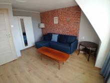 Apartament nr 4 - Pokój gościnny, sofa, stolik Apartament nr 4 - Pokój gościnny, sofa, stolik